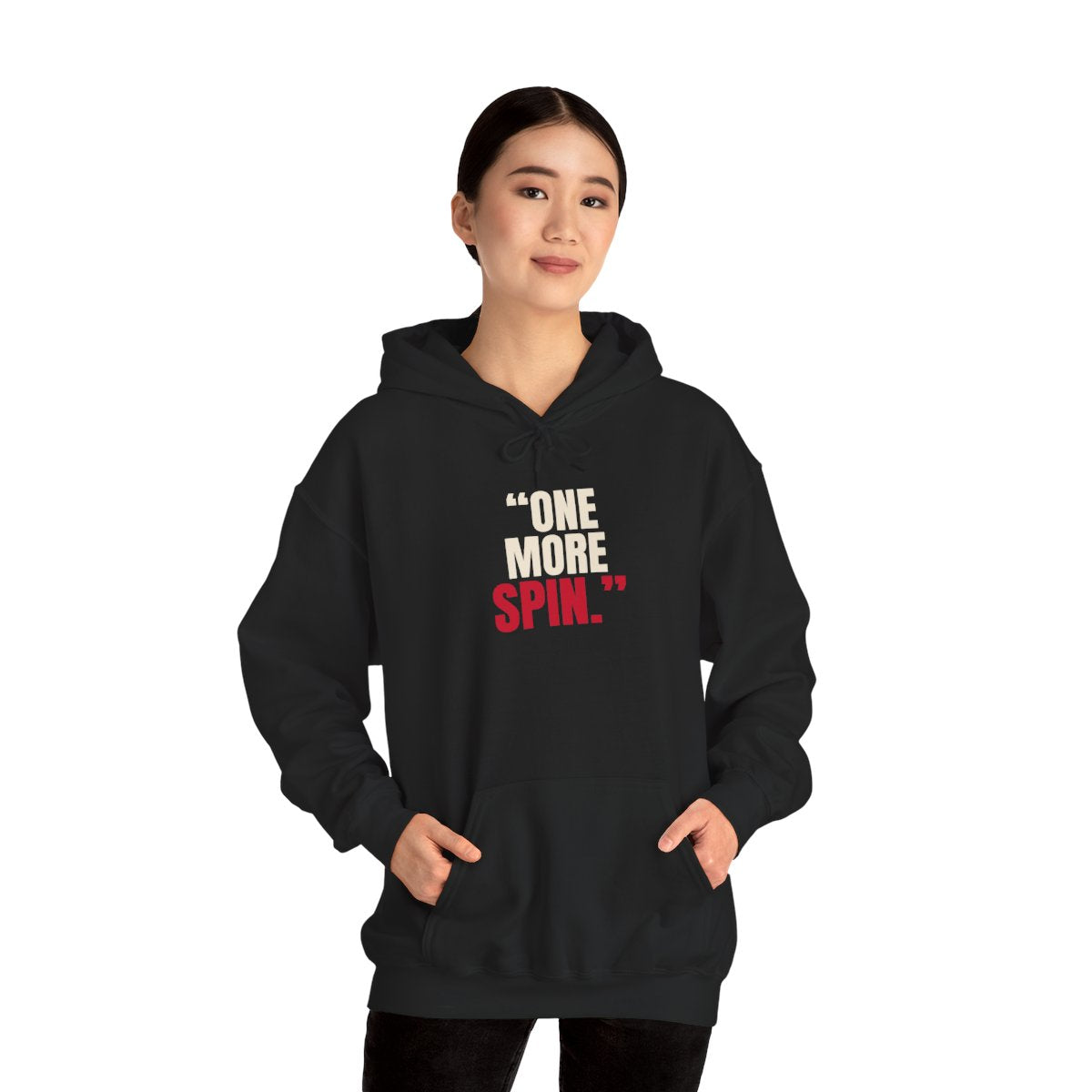 "One More Spin." — Roulette Hoodie (Black, worn, front)