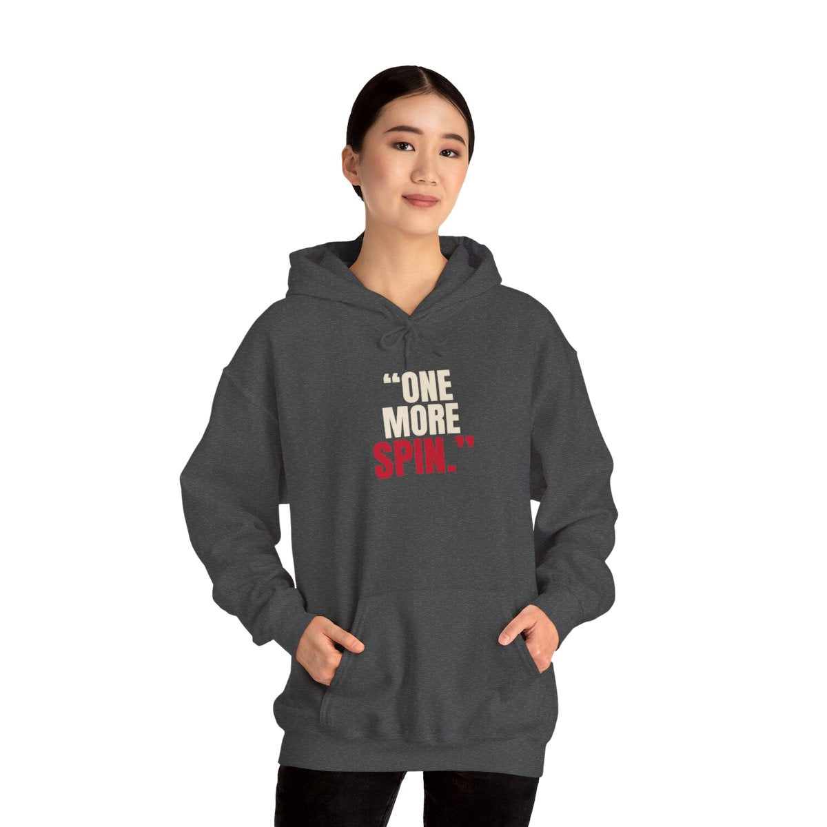 "One More Spin." — Roulette Hoodie (Dark Heather, worn, front)