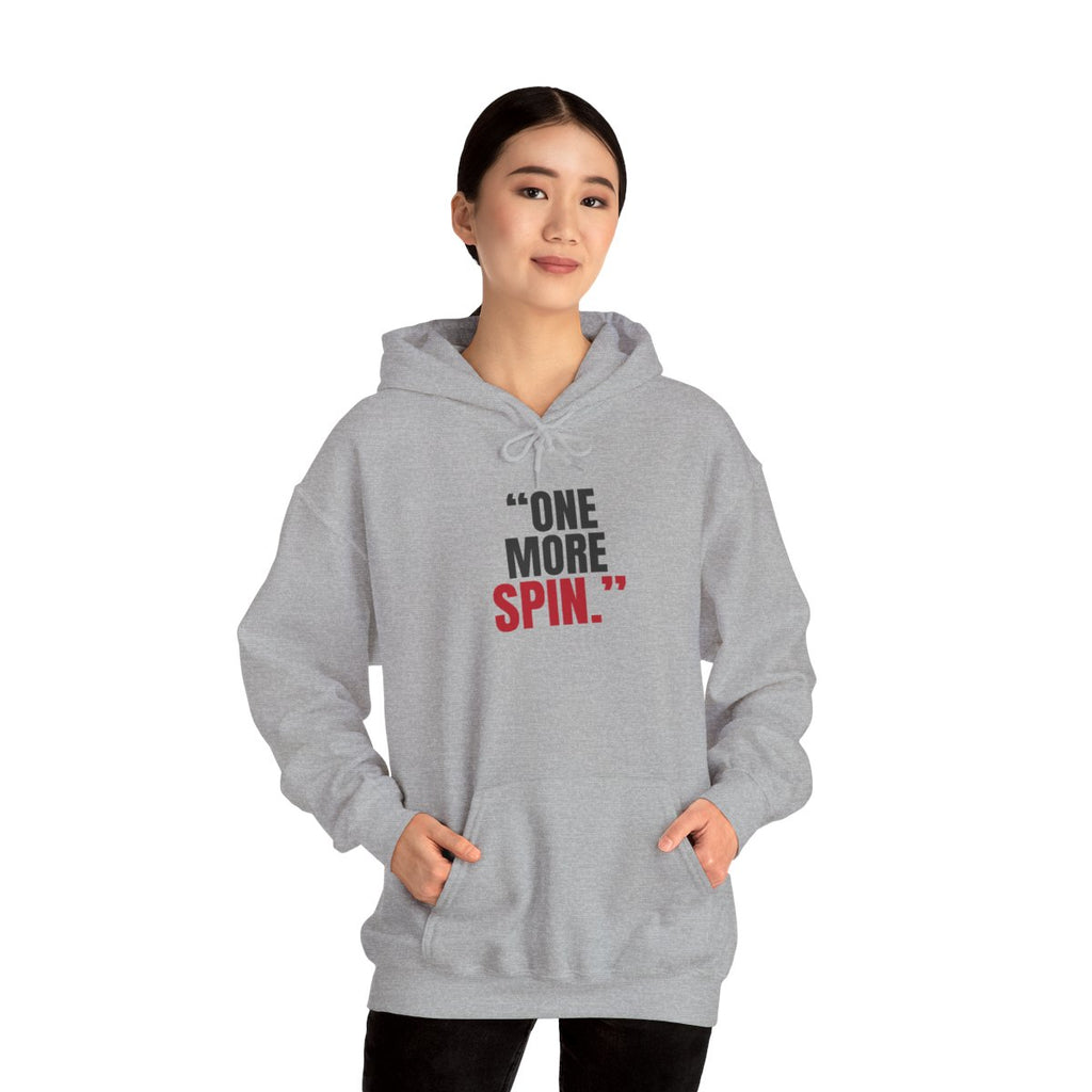 "One More Spin." — Roulette Hoodie (Sport Grey, worn, front)