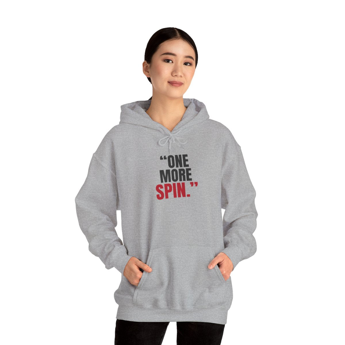 "One More Spin." — Roulette Hoodie (Sport Grey, worn, front)