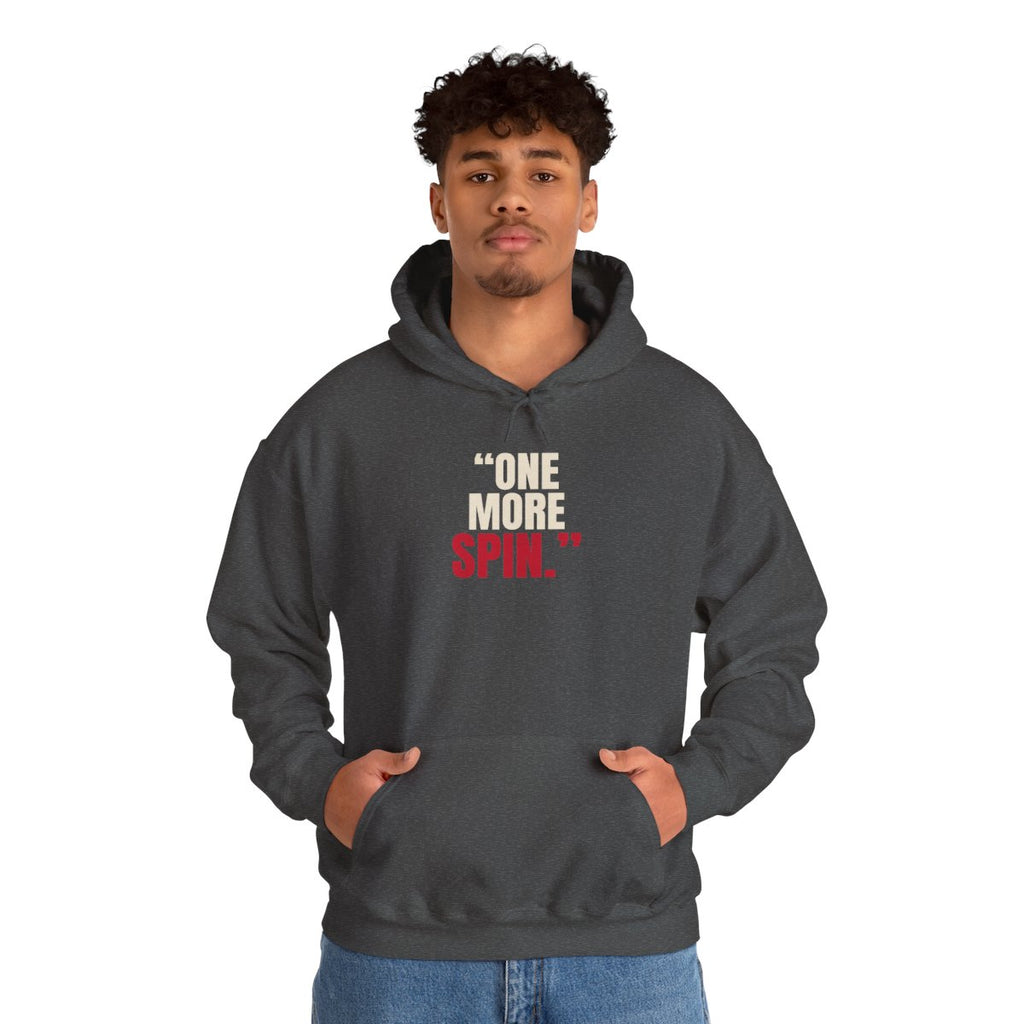 "One More Spin." — Roulette Hoodie (Dark Heather, worn, front)
