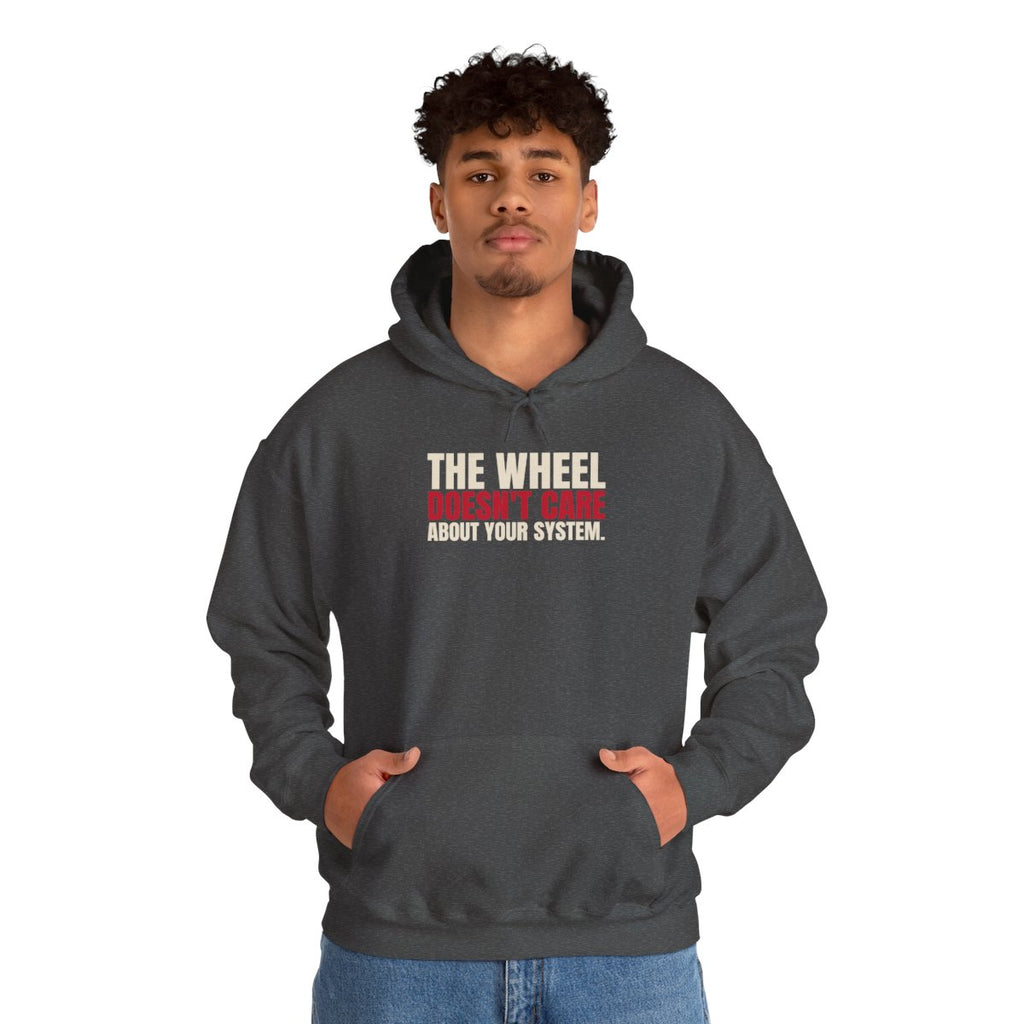 The Wheel Doesn't Care About Your System. — Roulette Hoodie (Dark Heather, worn, front)