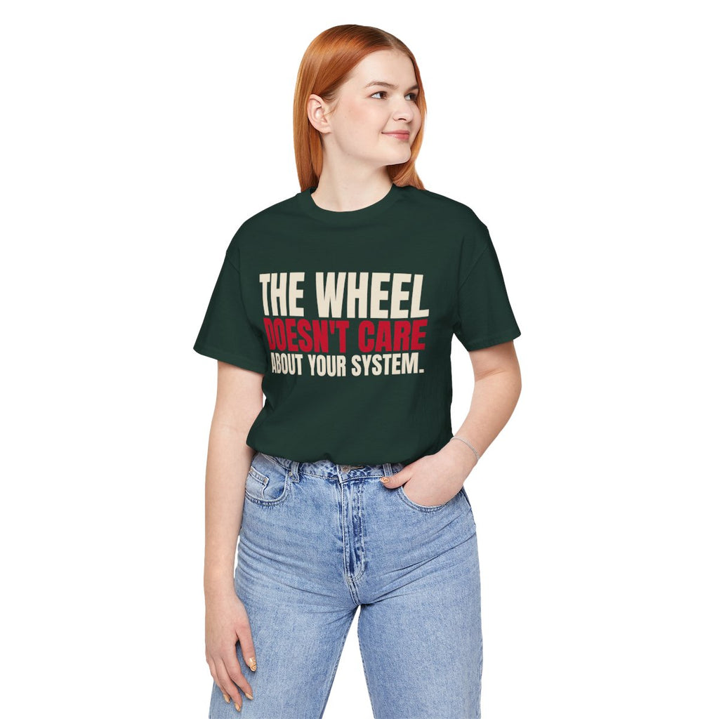 The Wheel Doesn't Care About Your System. — Roulette Tee (Forest, worn, front)