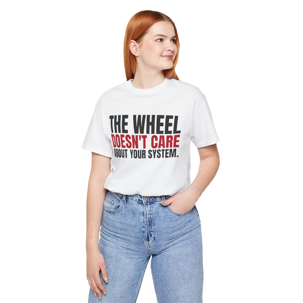 The Wheel Doesn't Care About Your System. — Roulette Tee (White, worn, front)