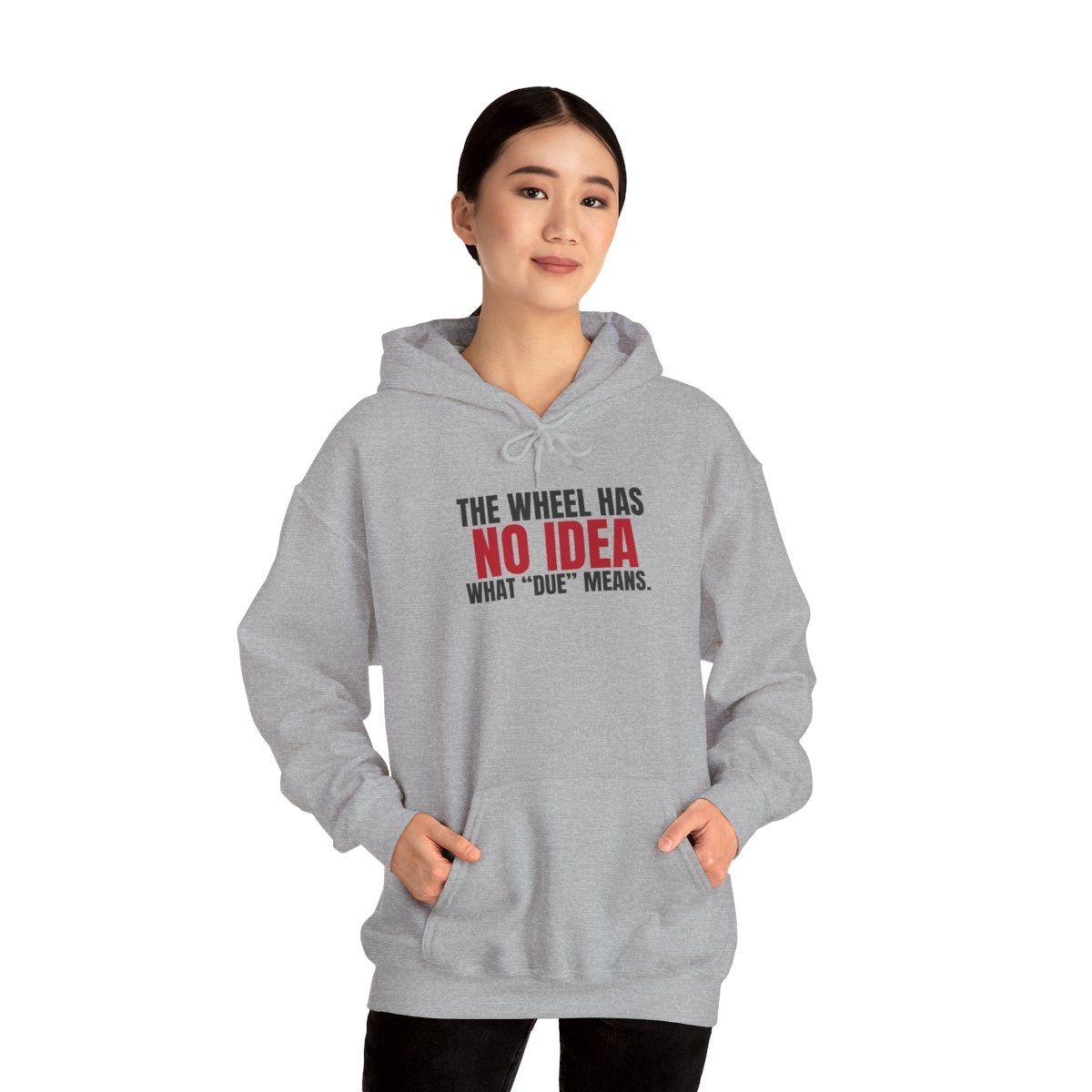 The Wheel Has No Idea What "Due" Means. — Roulette Hoodie (Sport Grey, worn, front)