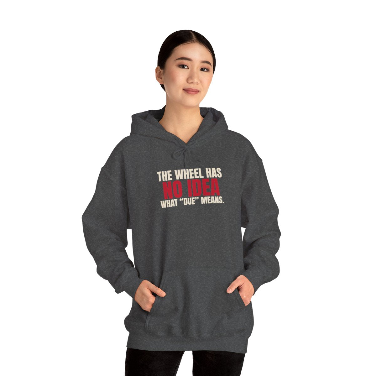 The Wheel Has No Idea What "Due" Means. — Roulette Hoodie (Dark Heather, worn, front)