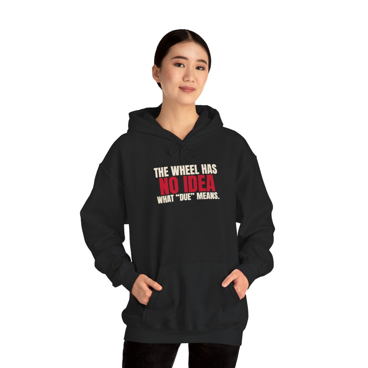 The Wheel Has No Idea What "Due" Means. — Roulette Hoodie (Black, worn, front)