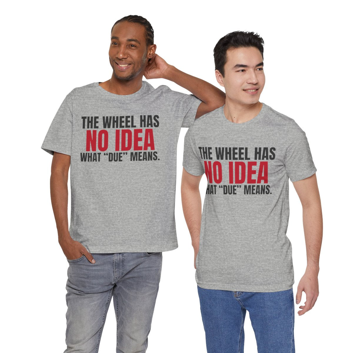 The Wheel Has No Idea What "Due" Means. — Roulette Tee (Athletic Heather, worn by two, front)