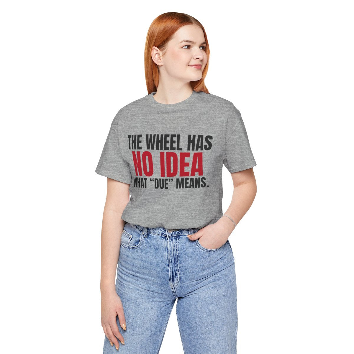 The Wheel Has No Idea What "Due" Means. — Roulette Tee (Athletic Heather, worn, front)